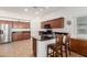 Well-equipped kitchen with an island, granite countertops, and wood cabinets at 2101 S Meridian Rd # 268, Apache Junction, AZ 85120