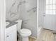 Modern bathroom with marble tile and walk-in shower at 232 W Lincoln Ave, Coolidge, AZ 85128