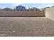 Landscaped backyard with gravel and block wall at 26520 N 132Nd Ln, Peoria, AZ 85383