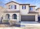 Two-story house with brown garage door and Spanish-style roof at 26520 N 132Nd Ln, Peoria, AZ 85383
