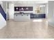 Open concept kitchen with island and modern cabinetry at 26520 N 132Nd Ln, Peoria, AZ 85383