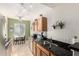 Eat-in kitchen with granite counters and wood cabinets at 2929 W Yorkshire Dr # 1060, Phoenix, AZ 85027