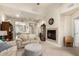 Spacious living room with a fireplace and view into kitchen at 2929 W Yorkshire Dr # 1060, Phoenix, AZ 85027