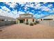 Spacious backyard with gravel and a two-story house at 3641 N 309Th Dr, Buckeye, AZ 85396