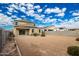 Spacious backyard with gravel and a two-story house at 3641 N 309Th Dr, Buckeye, AZ 85396