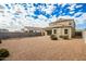 Spacious backyard with gravel and a two-story house at 3641 N 309Th Dr, Buckeye, AZ 85396