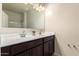 Double vanity bathroom with a large mirror and bright lighting at 3641 N 309Th Dr, Buckeye, AZ 85396