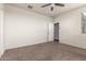 Bright bedroom with closet and neutral wall colors at 3641 N 309Th Dr, Buckeye, AZ 85396