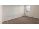 Well-lit bedroom with carpeted floor and window with blinds at 3641 N 309Th Dr, Buckeye, AZ 85396