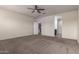 Large bedroom with carpet, ceiling fan and ensuite bathroom at 3641 N 309Th Dr, Buckeye, AZ 85396
