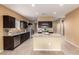 Spacious kitchen with dark cabinets and granite countertops at 3641 N 309Th Dr, Buckeye, AZ 85396