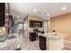 Spacious kitchen with granite island and dark cabinets at 3641 N 309Th Dr, Buckeye, AZ 85396