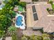 Aerial view of home showcasing pool and solar panels at 3731 E Halifax Cir, Mesa, AZ 85205