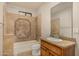 Clean bathroom with tile shower/tub combo and granite vanity at 3731 E Halifax Cir, Mesa, AZ 85205