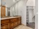 Bathroom with granite vanity and built-in shelving at 3731 E Halifax Cir, Mesa, AZ 85205