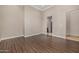 Spacious bedroom with hardwood floors and access to bathroom at 3731 E Halifax Cir, Mesa, AZ 85205