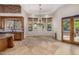 Bright breakfast nook with access to the backyard and pool at 3731 E Halifax Cir, Mesa, AZ 85205