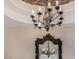 Elegant chandelier with intricate details, reflecting in ornate mirror at 3731 E Halifax Cir, Mesa, AZ 85205