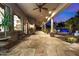 Elegant covered patio with flagstone flooring, offering an outdoor living space at 3731 E Halifax Cir, Mesa, AZ 85205