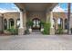 Elegant entryway with stone columns, arched windows, and a grand door at 3731 E Halifax Cir, Mesa, AZ 85205