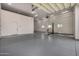 Extra large garage with car lift and additional storage at 3731 E Halifax Cir, Mesa, AZ 85205