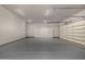 Large garage offering abundant storage with overhead cabinets at 3731 E Halifax Cir, Mesa, AZ 85205
