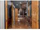 Elegant hallway with wood floors and custom doors at 3731 E Halifax Cir, Mesa, AZ 85205