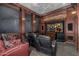 Home theater with leather recliner seating and large screen at 3731 E Halifax Cir, Mesa, AZ 85205