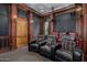 Luxurious home theater with plush seating and large screen at 3731 E Halifax Cir, Mesa, AZ 85205