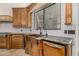 Copper farmhouse sink and granite countertops in a spacious kitchen at 3731 E Halifax Cir, Mesa, AZ 85205