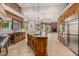 Open concept kitchen with large island and high-end finishes at 3731 E Halifax Cir, Mesa, AZ 85205