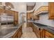 Bright kitchen with stainless steel appliances and custom cabinetry at 3731 E Halifax Cir, Mesa, AZ 85205