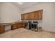 Bright laundry room with ample cabinetry and modern appliances at 3731 E Halifax Cir, Mesa, AZ 85205