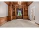Study or library with built-in wooden bookshelves and a window at 3731 E Halifax Cir, Mesa, AZ 85205