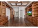 Library with hardwood floors, built-in bookshelves, and access to hallway at 3731 E Halifax Cir, Mesa, AZ 85205