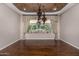Bright living room with hardwood floors, large window, and backyard view at 3731 E Halifax Cir, Mesa, AZ 85205
