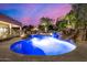 Luxury pool with a waterfall and spa, perfect for relaxation at 3731 E Halifax Cir, Mesa, AZ 85205