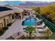Resort-style backyard oasis featuring a large pool, spa, and outdoor entertaining areas at 4119 S Las Villa Way, Gold Canyon, AZ 85118