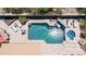 Stunning aerial view of pool with hot tub, tanning deck, swim up bar, and desert landscaping at 4119 S Las Villa Way, Gold Canyon, AZ 85118