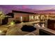 Stunning backyard features a pool and spa with outdoor kitchen, creating an ideal space for entertaining and relaxing at 4119 S Las Villa Way, Gold Canyon, AZ 85118