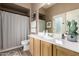 Bathroom featuring a vanity with a single sink, a mirror, and a shower at 4119 S Las Villa Way, Gold Canyon, AZ 85118
