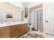 Cozy bathroom featuring a vanity with double sinks, and bathtub shower combo at 4119 S Las Villa Way, Gold Canyon, AZ 85118