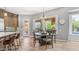 Bright dining area with hardwood floors, stylish chandelier and a view of the pool at 4119 S Las Villa Way, Gold Canyon, AZ 85118