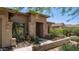 Inviting front entrance with stone accents, desert landscaping, and views of the neighborhood at 4119 S Las Villa Way, Gold Canyon, AZ 85118