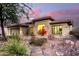 Beautiful home exterior featuring stone accents, and a well-manicured desert landscape at 4119 S Las Villa Way, Gold Canyon, AZ 85118