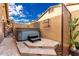 Private hot tub area with stone tile and privacy screen at 4119 S Las Villa Way, Gold Canyon, AZ 85118