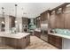 Modern kitchen boasting sleek cabinets, stainless steel appliances, tile backsplash, and a center island at 4119 S Las Villa Way, Gold Canyon, AZ 85118