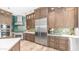Modern kitchen with stainless steel appliances, custom cabinetry, and sleek countertops at 4119 S Las Villa Way, Gold Canyon, AZ 85118