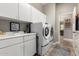 Efficient laundry room with modern appliances and ample storage space at 4119 S Las Villa Way, Gold Canyon, AZ 85118