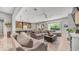 Open-concept living room flowing into a modern kitchen, creating a spacious and inviting atmosphere at 4119 S Las Villa Way, Gold Canyon, AZ 85118